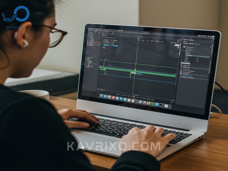 college-student-focused-on-a-macbook-pro-displaying-a-video-editing-timeline-and-lecture-notes