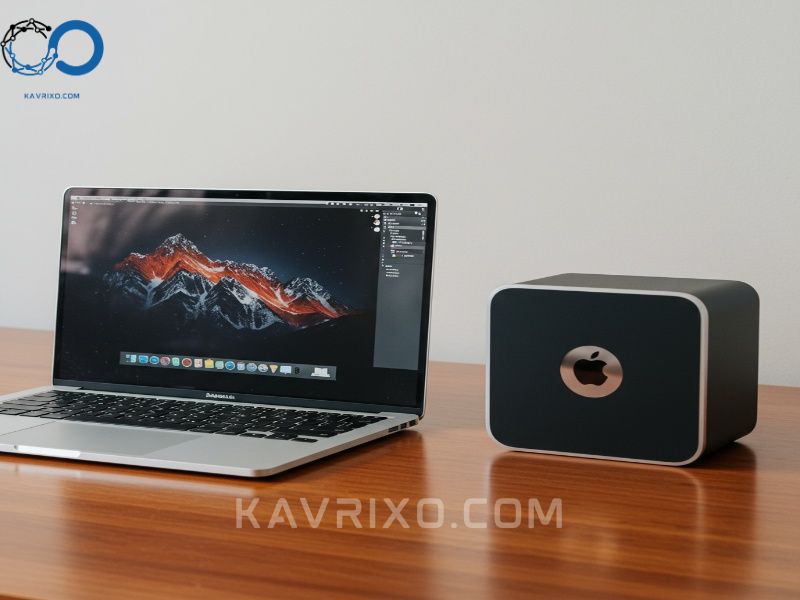 macbook-pro-14-inch-next-to-mac-studio-on-a-wooden-desk-comparing-portability-and-desktop-performance